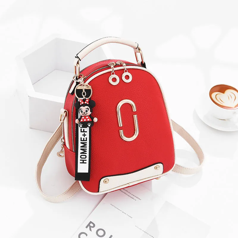 Fashion backpack for women in PU leather oval shape with double shoulder straps and car suture detail