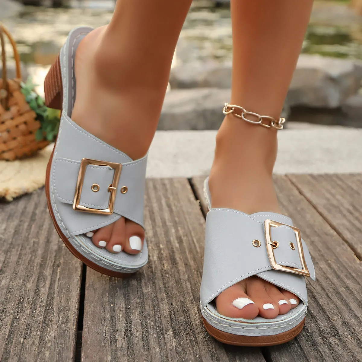 Women's black retro chunky heel sandals with a round toe and silver metal buckle on a rubber sole.