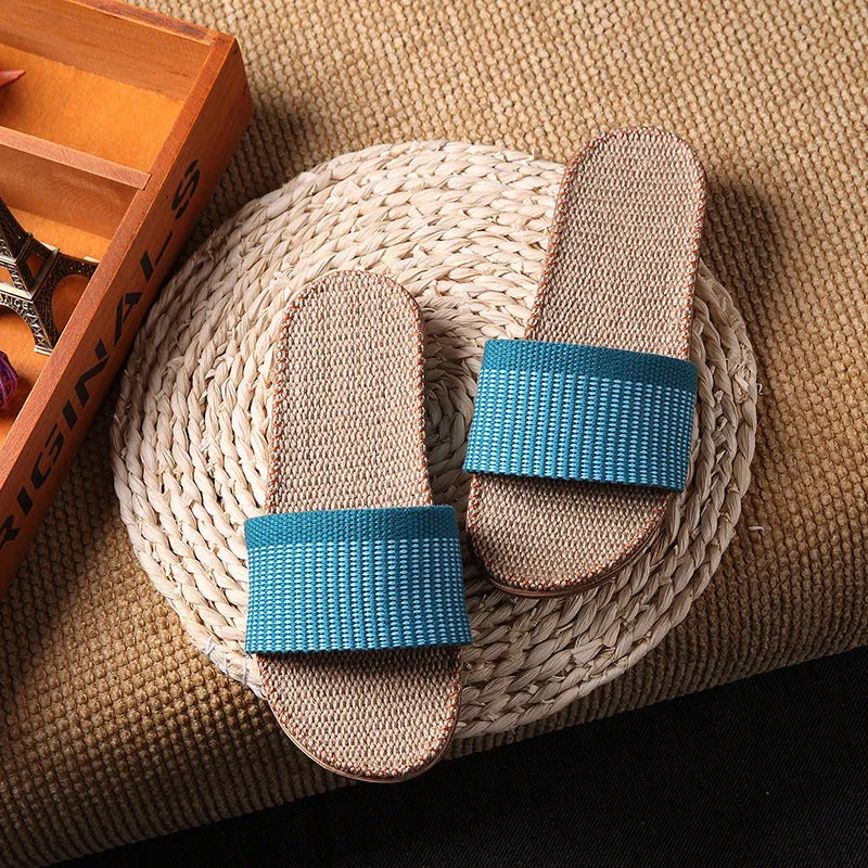 Linen open-toe home slippers with EVA sole in woven blue colour on a light background