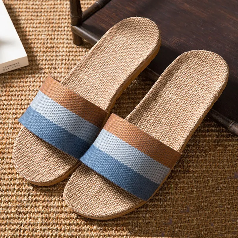 Linen open-toe home slippers with EVA sole in woven blue colour on a light background