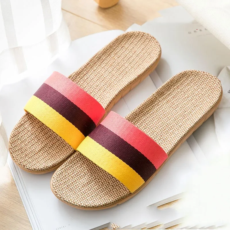 Linen open-toe home slippers with EVA sole in woven blue colour on a light background
