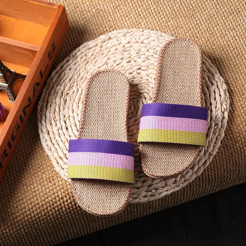 Linen open-toe home slippers with EVA sole in woven blue colour on a light background
