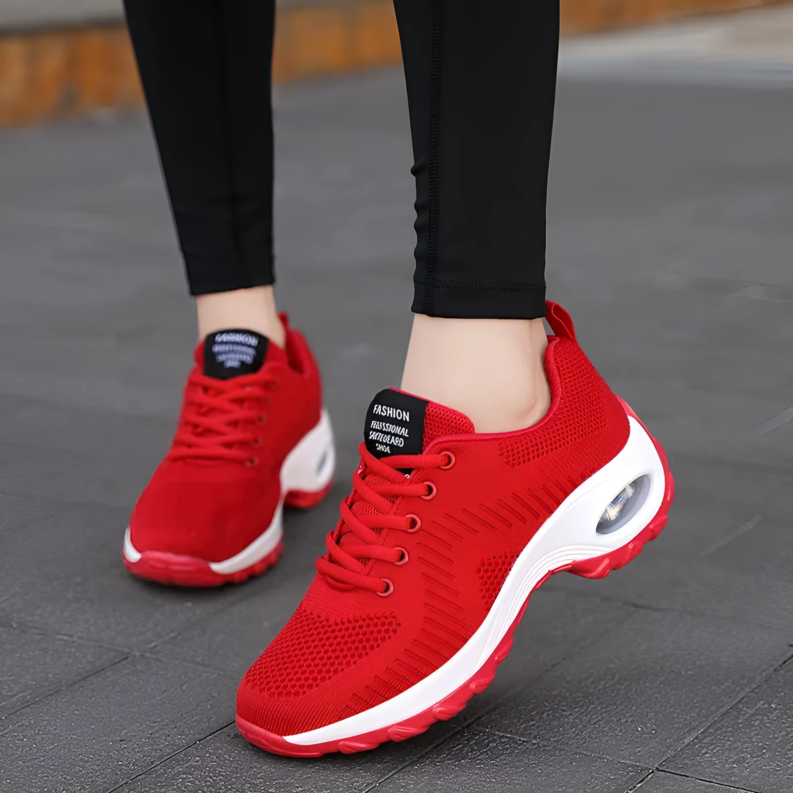 Women's red and black mesh lace-up sneakers with round toe and flat 3-5cm heel on a white background.