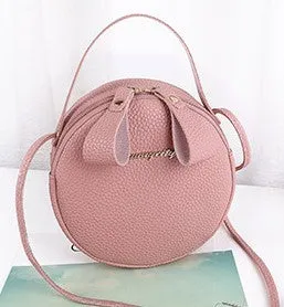 Women's round PU leather crossbody bag in circular shape, 17cm wide, with separate pouch