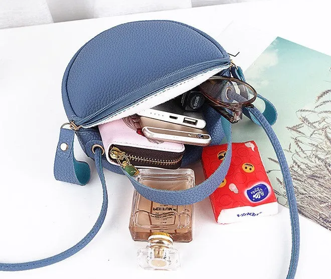 Women's round PU leather crossbody bag in circular shape, 17cm wide, with separate pouch
