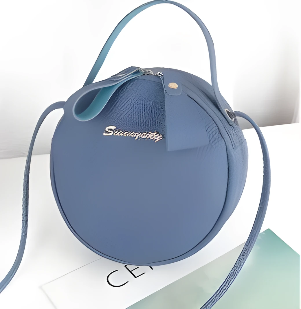 Women's round PU leather crossbody bag in circular shape, 17cm wide, with separate pouch