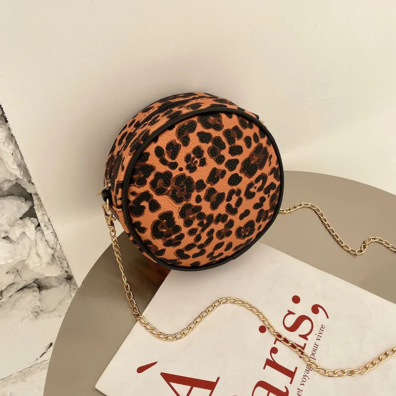 Women's round PU leather crossbody bag in circular shape, 17cm wide, with separate pouch
