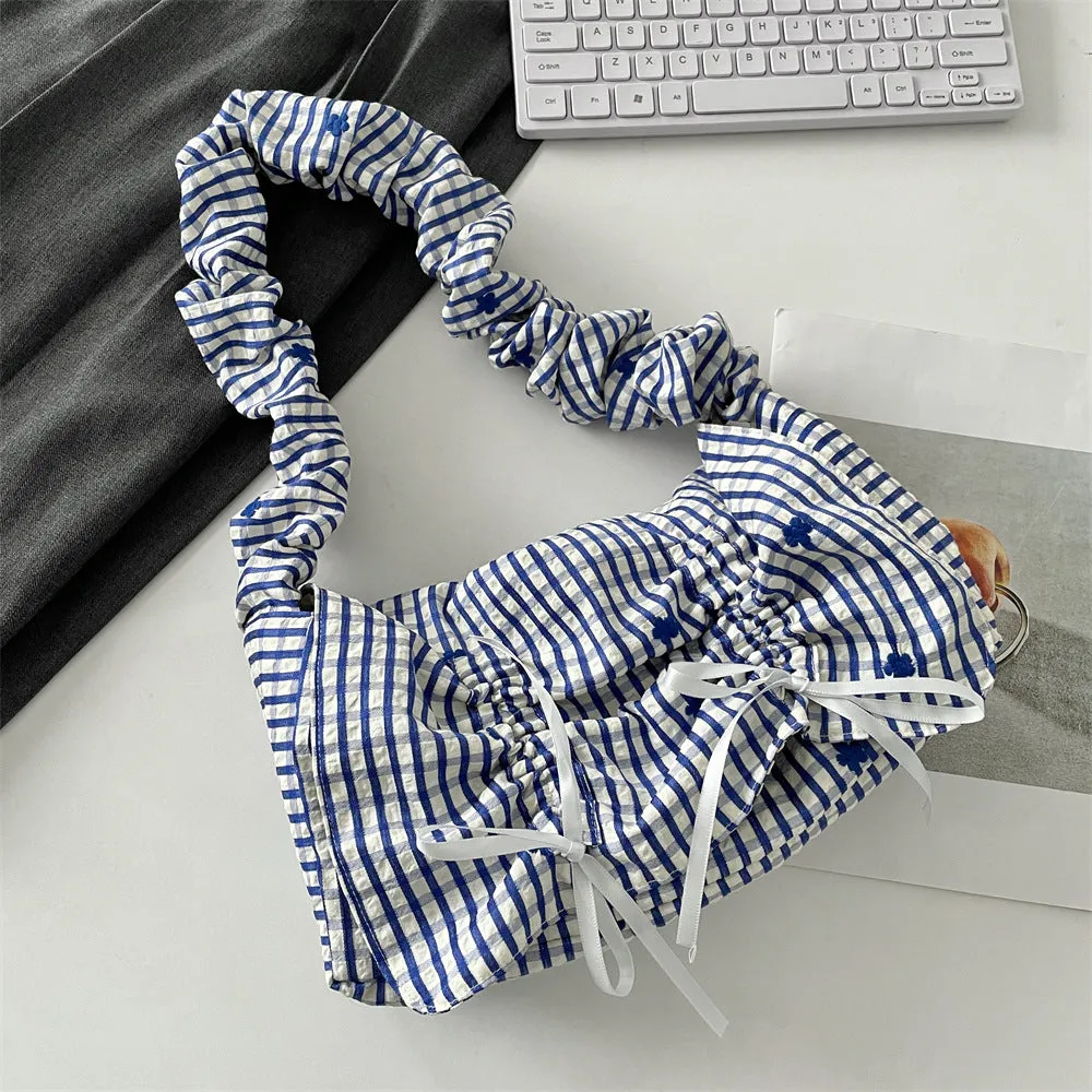 Women's soft polyester pleated flip shoulder bag with bow detail in blue plaid colour