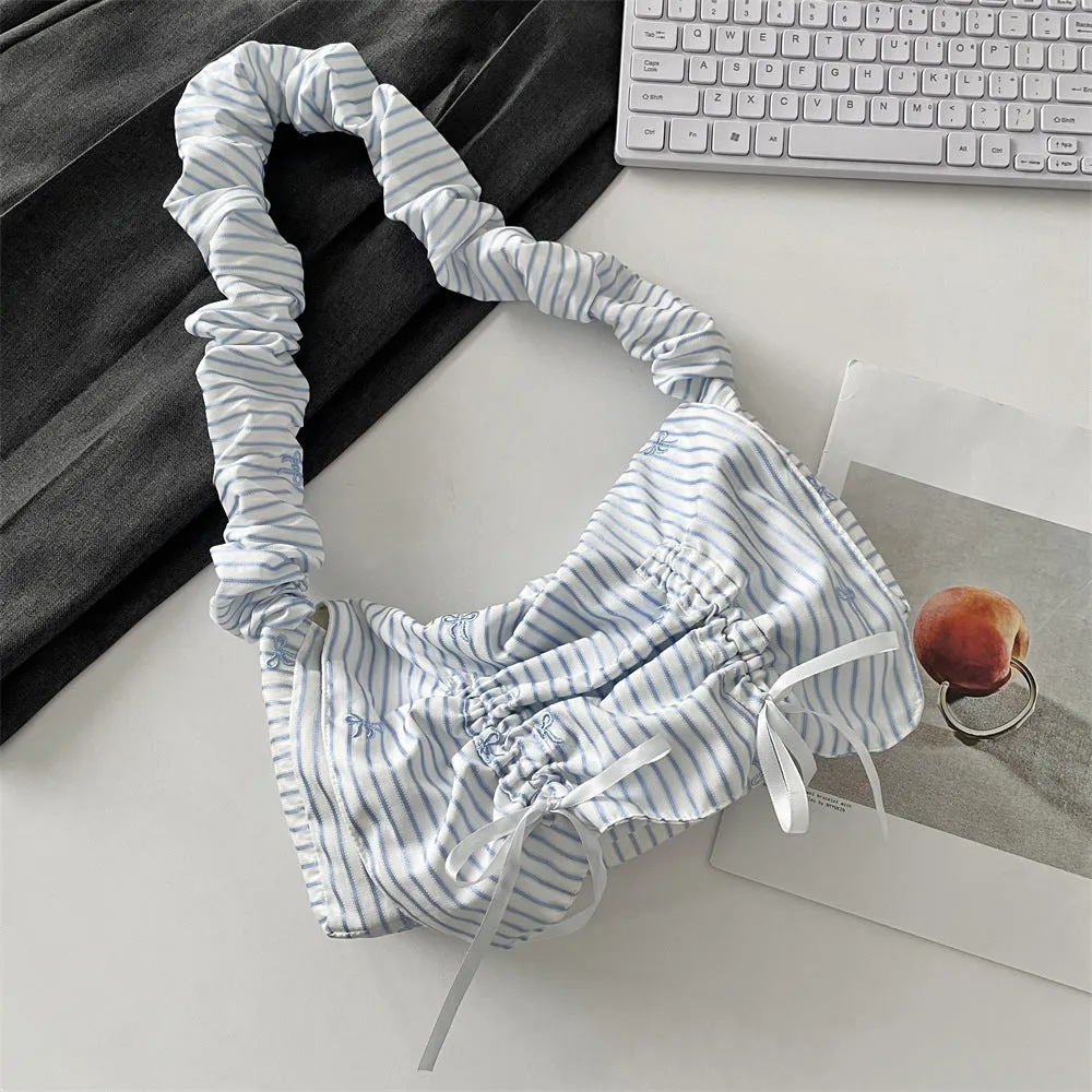 Women's soft polyester pleated flip shoulder bag with bow detail in blue plaid colour