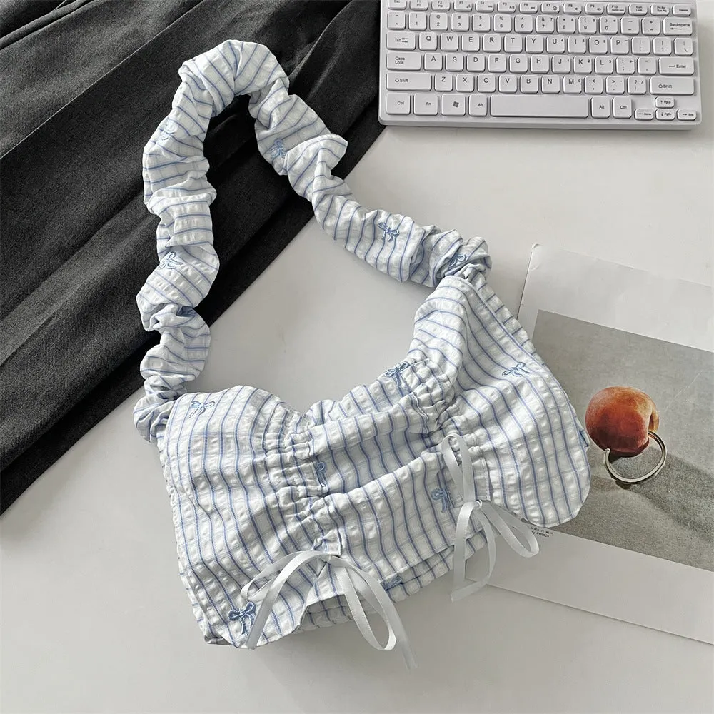 Women's soft polyester pleated flip shoulder bag with bow detail in blue plaid colour