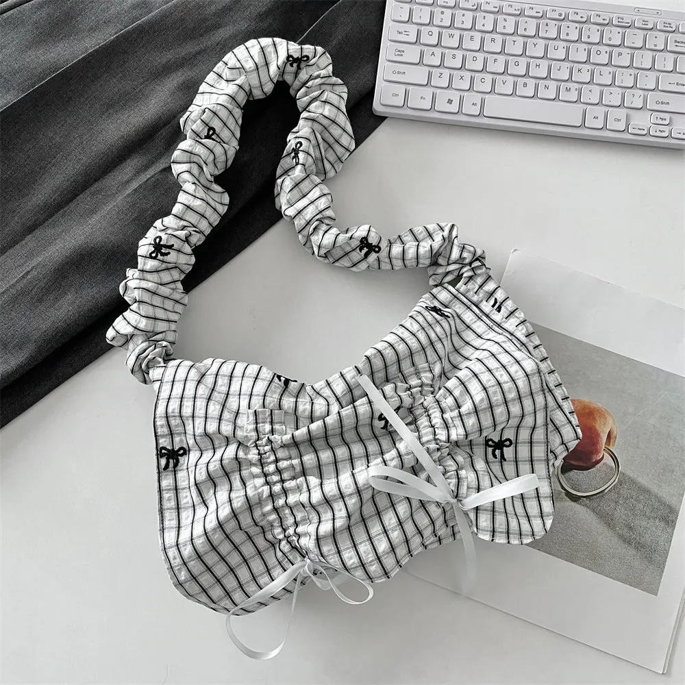 Women's soft polyester pleated flip shoulder bag with bow detail in blue plaid colour