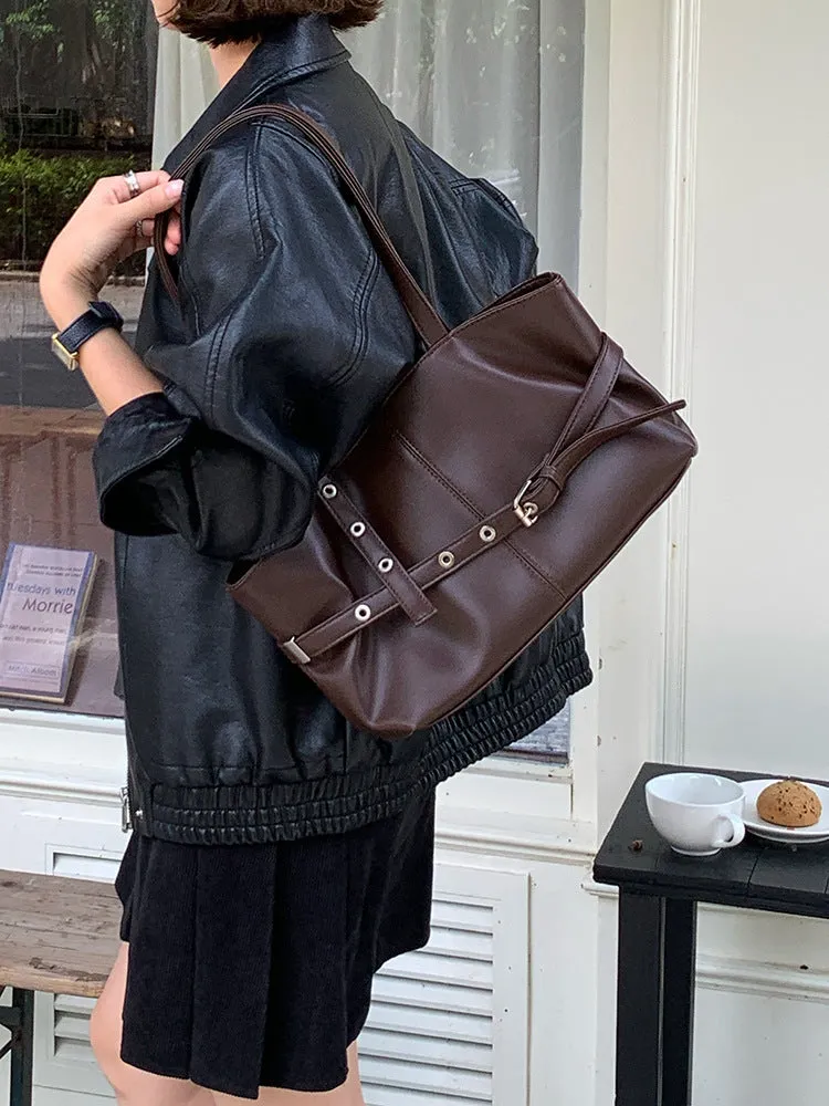 Women's large capacity PU shoulder bag in black with visible sewing line detail and horizontal square shape