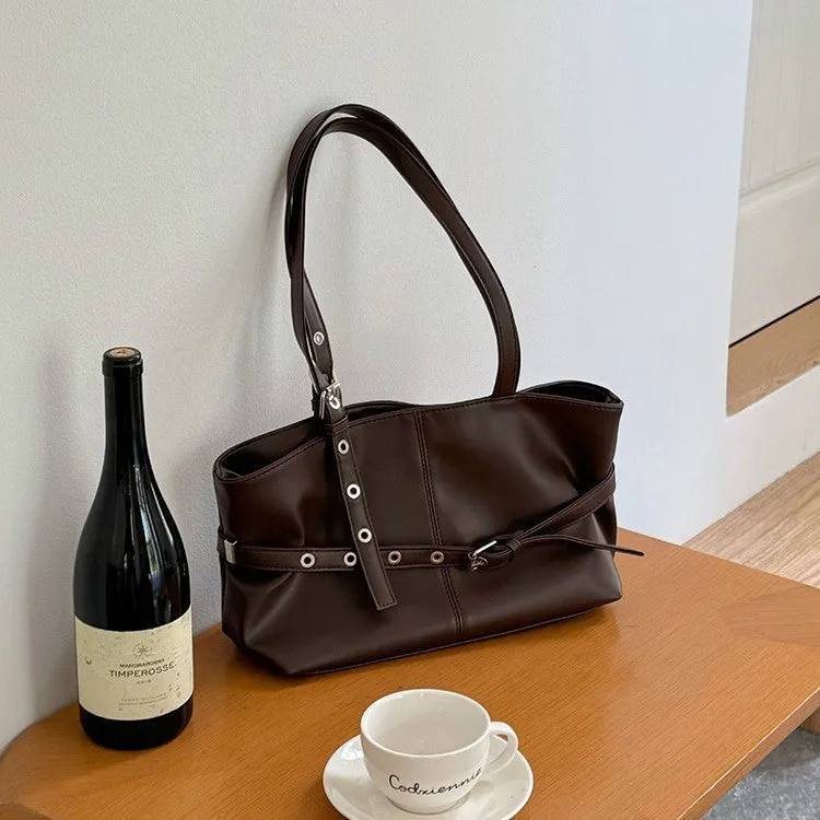 Women's large capacity PU shoulder bag in black with visible sewing line detail and horizontal square shape