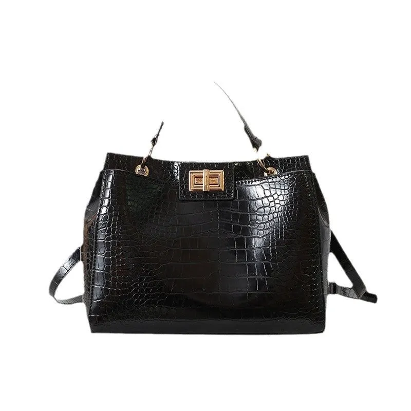 Retro western style messenger bag in black stone pattern with shoulder strap and square vertical shape