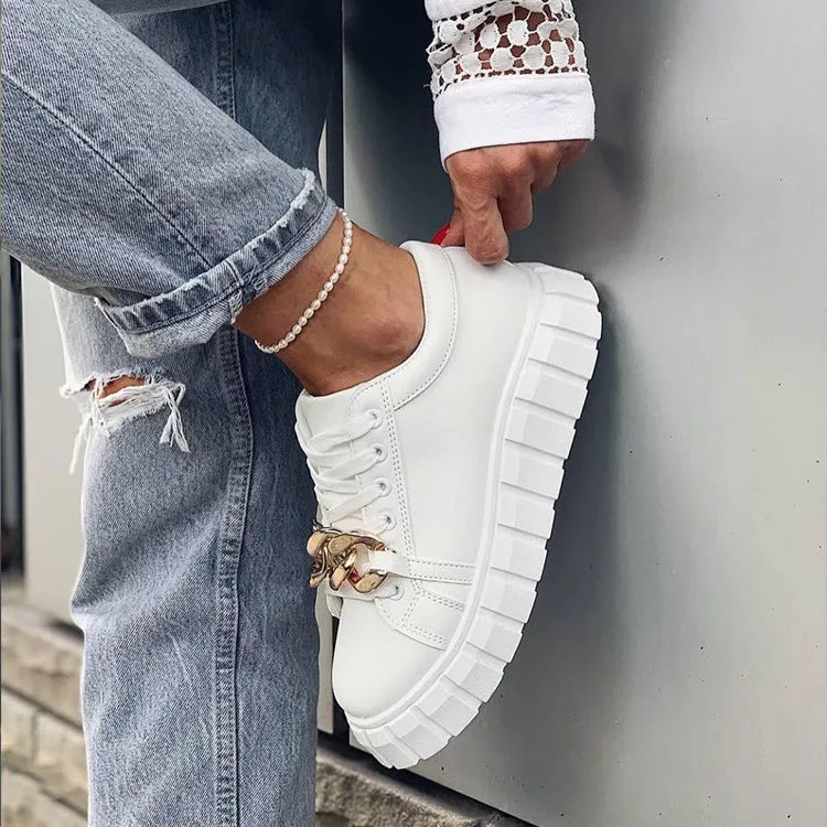 Low-top flat casual sneakers in artificial PU with rubber sole and front lace closure