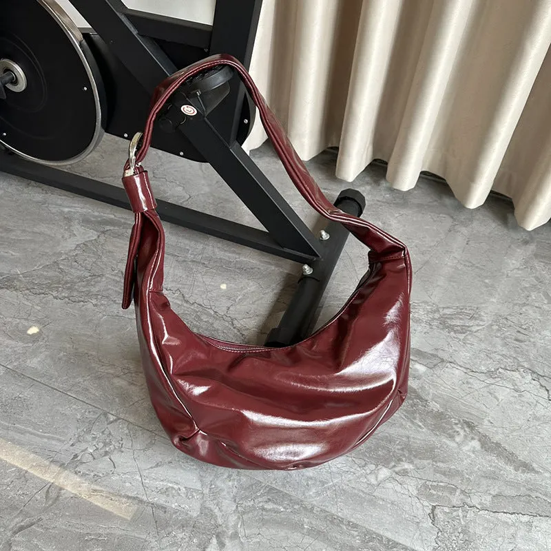 Soft PU large capacity commuter shoulder bag in black, horizontal square shape, with single shoulder strap