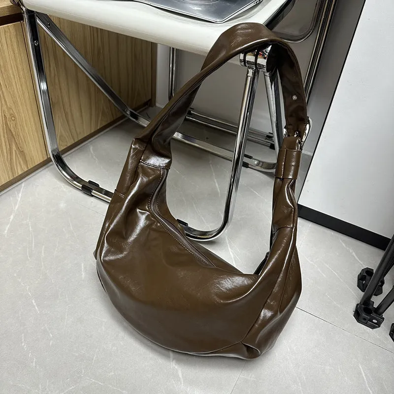 Soft PU large capacity commuter shoulder bag in black, horizontal square shape, with single shoulder strap