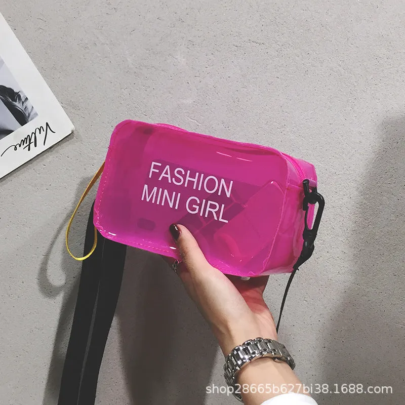 A transparent square jelly cross-body bag in a choice of colours, shown with an adjustable strap and a mobile phone inside.
