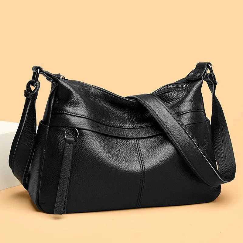 First layer leather one-shoulder crossbody handbag in caramel colour with outer pocket and silver hardware