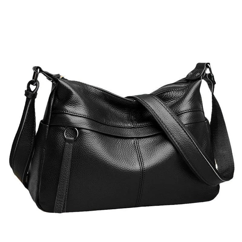 First layer leather one-shoulder crossbody handbag in caramel colour with outer pocket and silver hardware