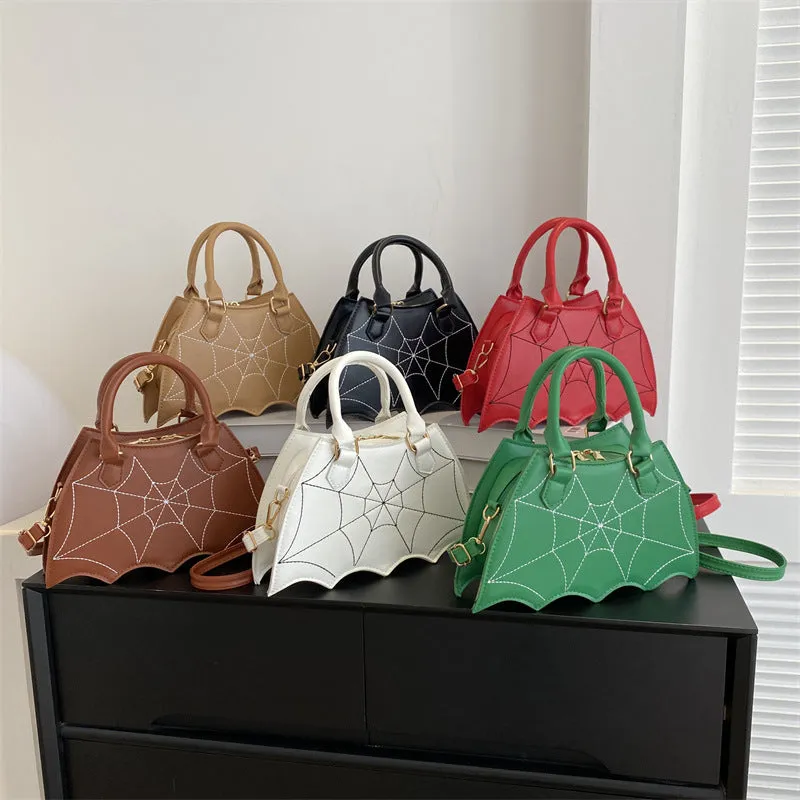 Women's small square PU saddle bag with spider web pattern, crossbody strap, and top handle, available in six colours including black and red