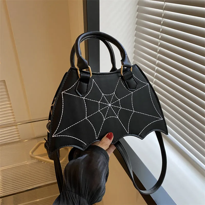 Women's small square PU saddle bag with spider web pattern, crossbody strap, and top handle, available in six colours including black and red