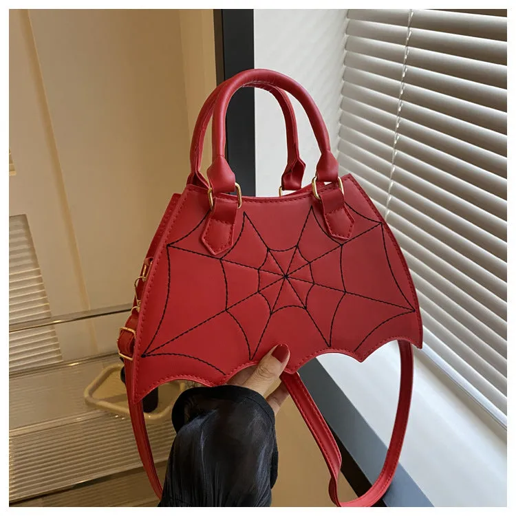 Women's small square PU saddle bag with spider web pattern, crossbody strap, and top handle, available in six colours including black and red