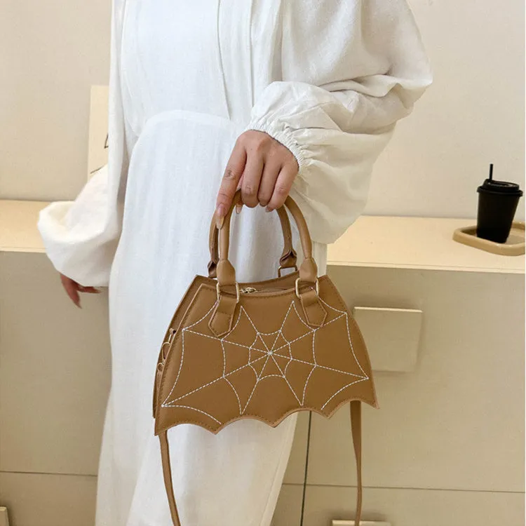 Women's small square PU saddle bag with spider web pattern, crossbody strap, and top handle, available in six colours including black and red