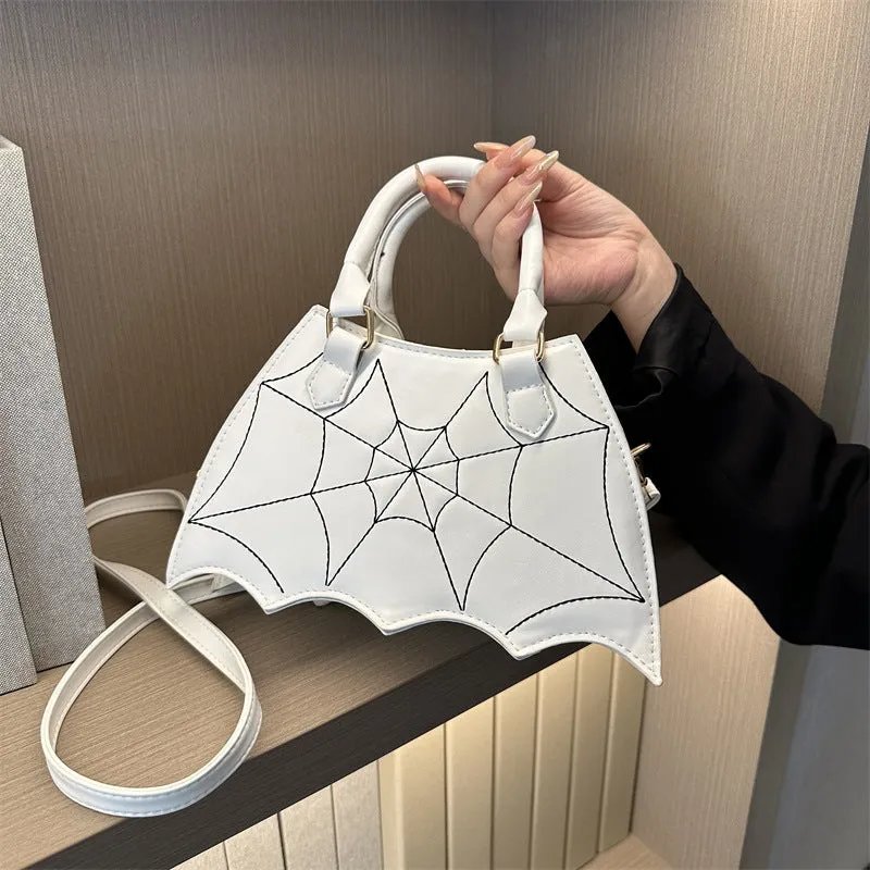 Women's small square PU saddle bag with spider web pattern, crossbody strap, and top handle, available in six colours including black and red