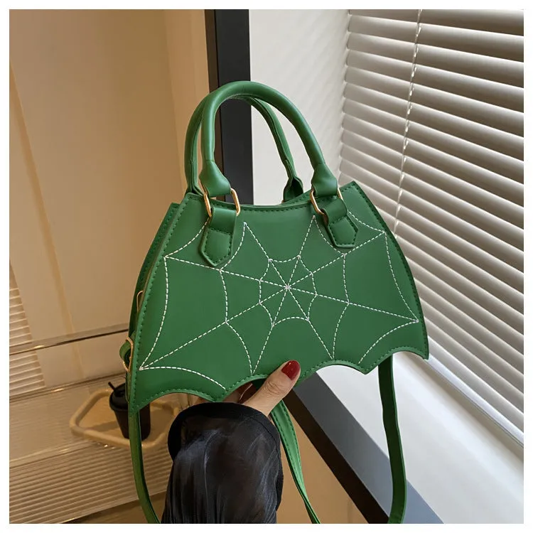 Women's small square PU saddle bag with spider web pattern, crossbody strap, and top handle, available in six colours including black and red