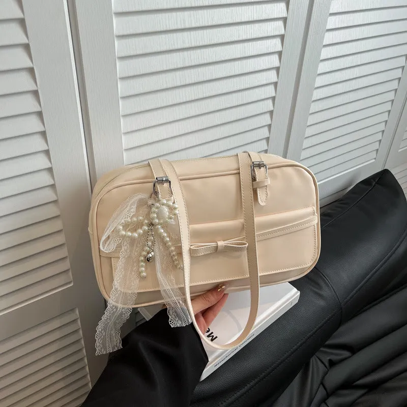 Women's PU leather single shoulder bag in horizontal square shape with flap closure and double straps