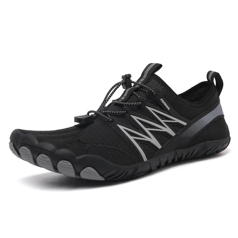 Low-top striped training sneakers with a flat rubber sole, shown in various colours including black and grey orange.