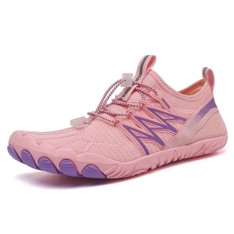 Low-top striped training sneakers with a flat rubber sole, shown in various colours including black and grey orange.