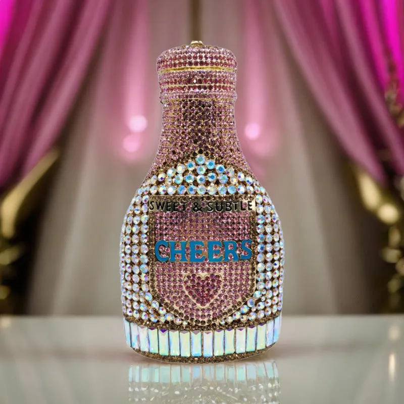 Gold hard evening clutch bag shaped like a champagne bottle with rhinestone decoration