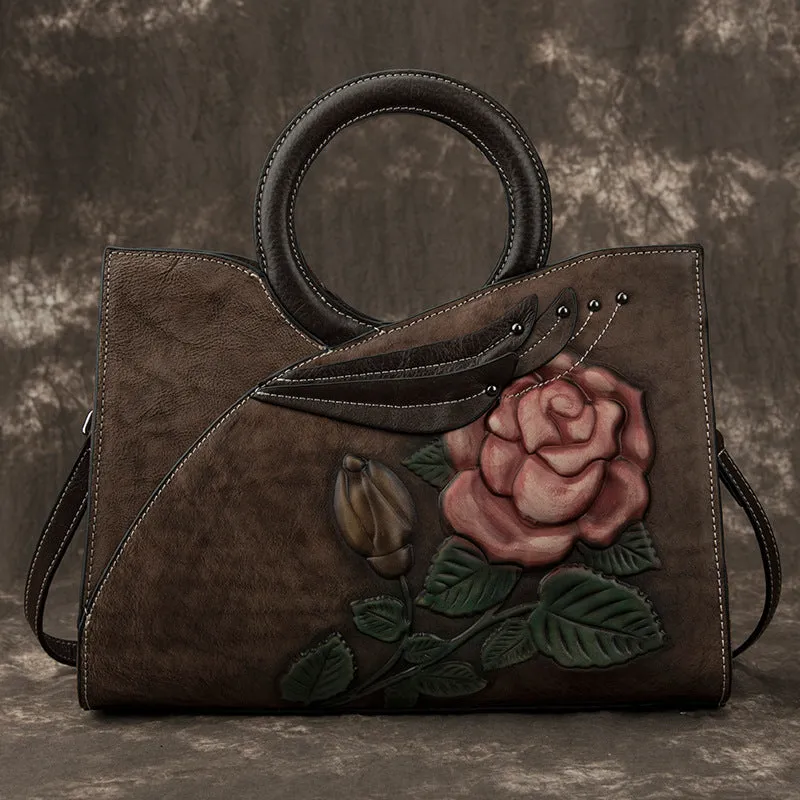 Handmade genuine leather women's handbag in contrasting colour with floral elements and zipper closure