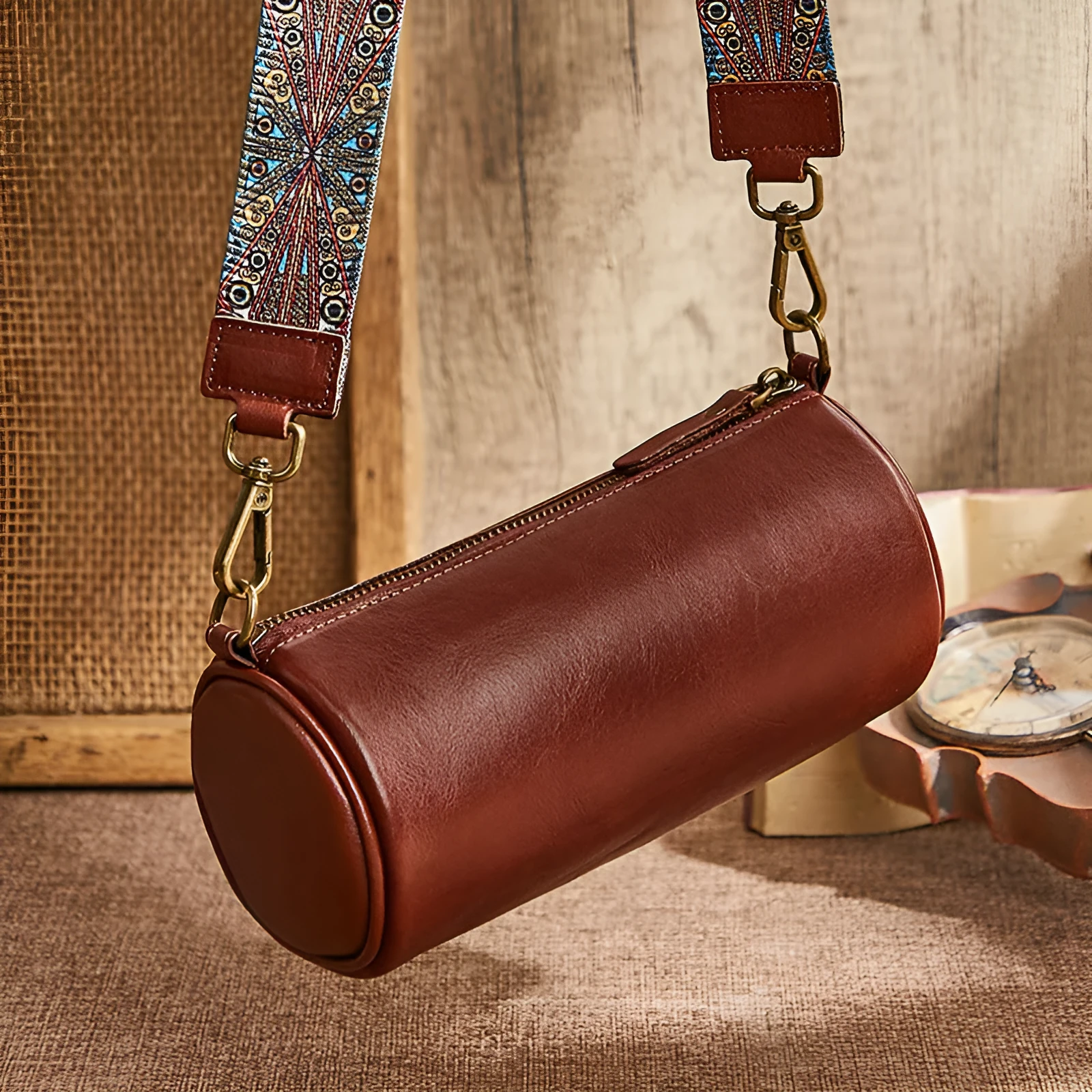 Top layer cowhide leather round single-shoulder bag in caramel brown with wide strap and sewing thread details
