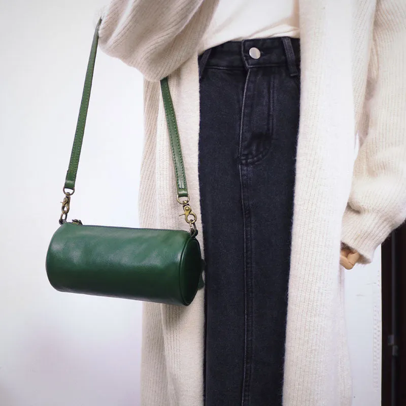 Top layer cowhide leather round single-shoulder bag in caramel brown with wide strap and sewing thread details