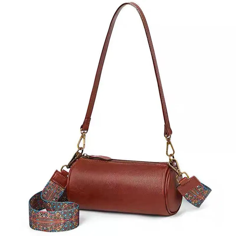 Top layer cowhide leather round single-shoulder bag in caramel brown with wide strap and sewing thread details