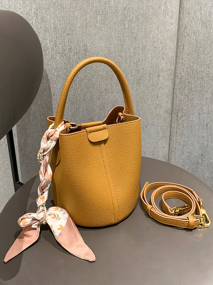 PU leather casual handbag for women with bow detail in golden brown