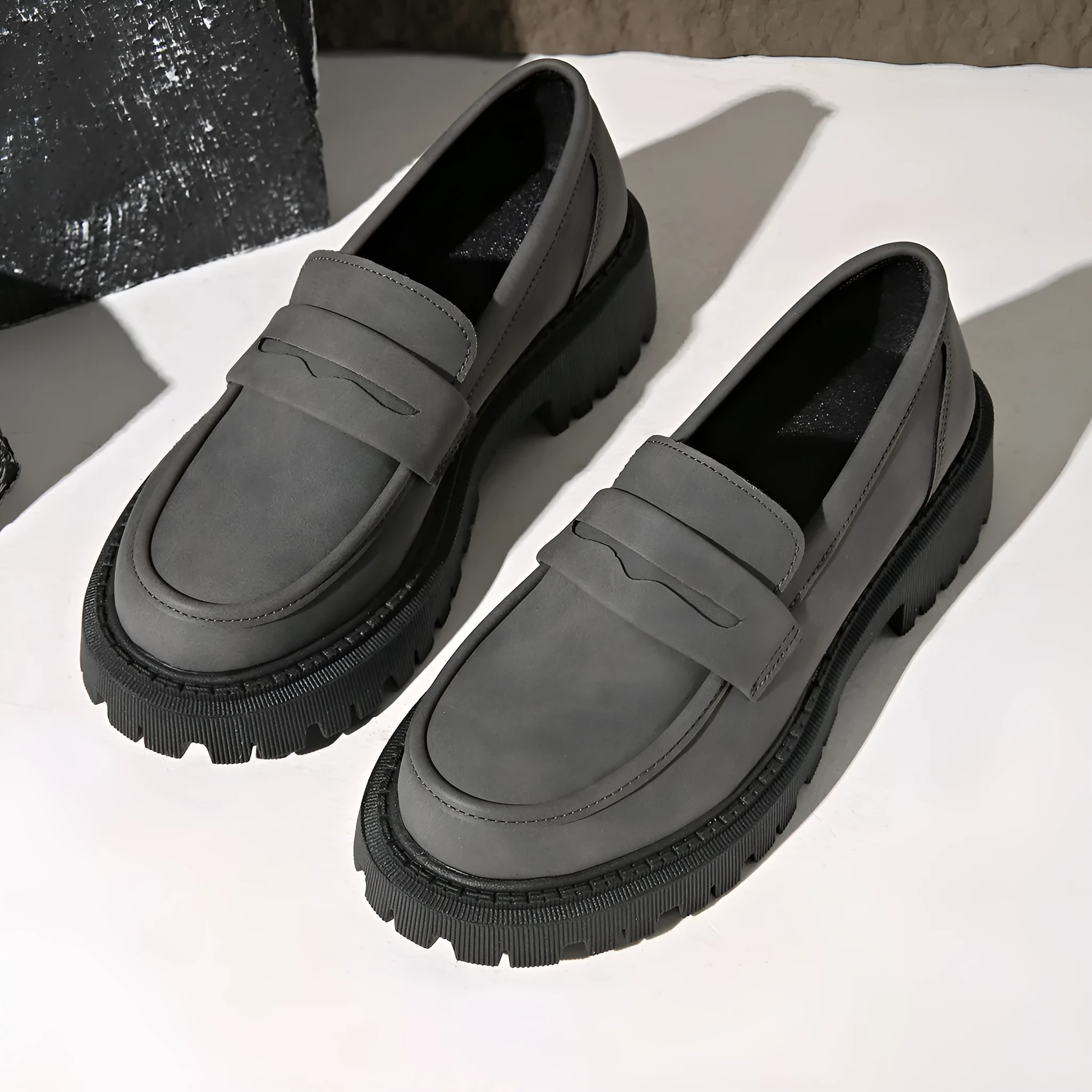 Gray British style slip-on low cut loafers with low heel and rubber sole