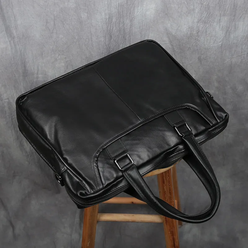 Black men's leather leisure briefcase with top layer cow hide, zipper closure, and shoulder strap
