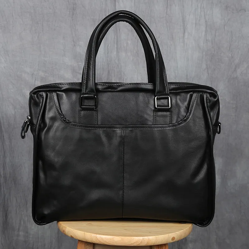 Black men's leather leisure briefcase with top layer cow hide, zipper closure, and shoulder strap