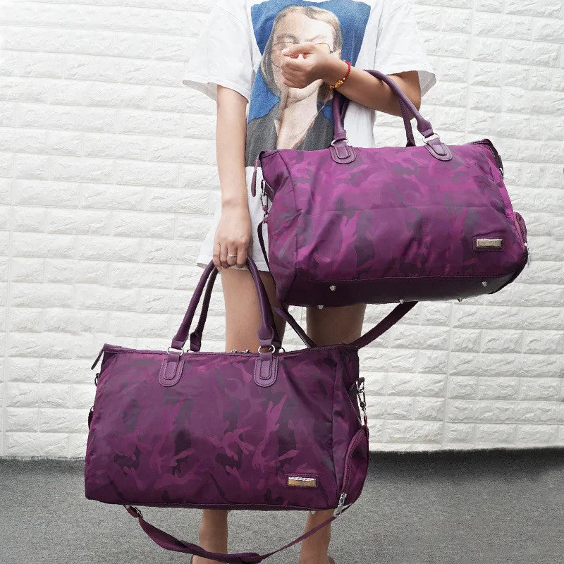Nylon travel bag in black with soft handle, top zipper, and multiple internal pockets