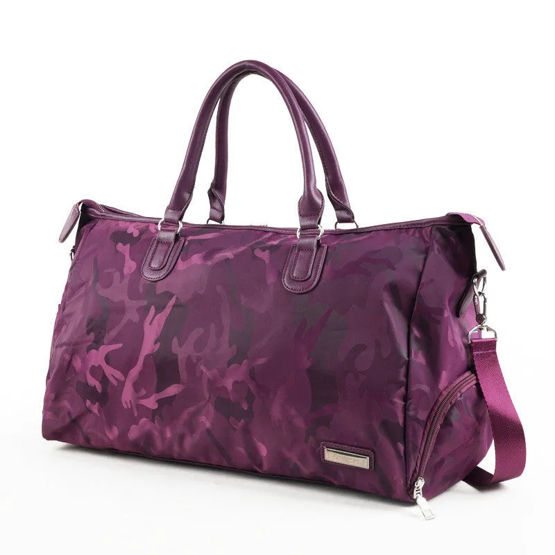 Nylon travel bag in black with soft handle, top zipper, and multiple internal pockets