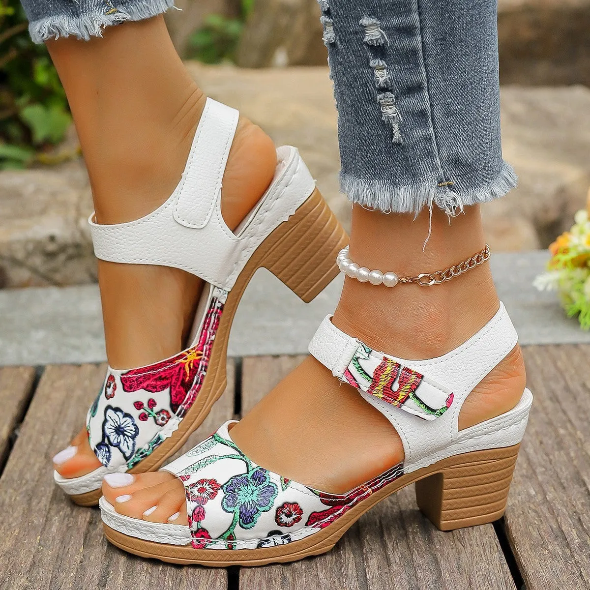 White women's high heel sandals with velcro buckle closure showing rubber sole