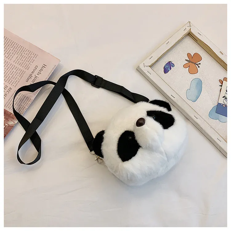 Soft plush panda head crossbody bag with cylindrical shape and outer pocket.