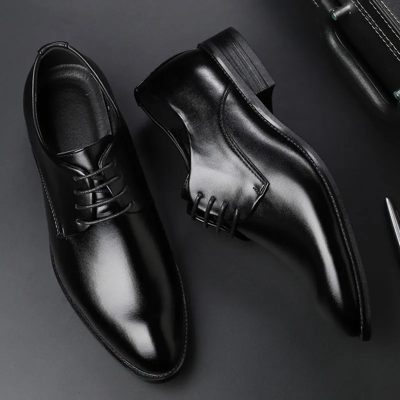 Men's black leather dress shoes with low heel and front strap on white background
