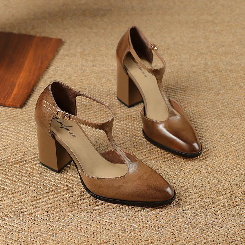 Women's pink and dark brown retro Mary Jane shoes with a pointed toe, buckle, and hollow design detail.