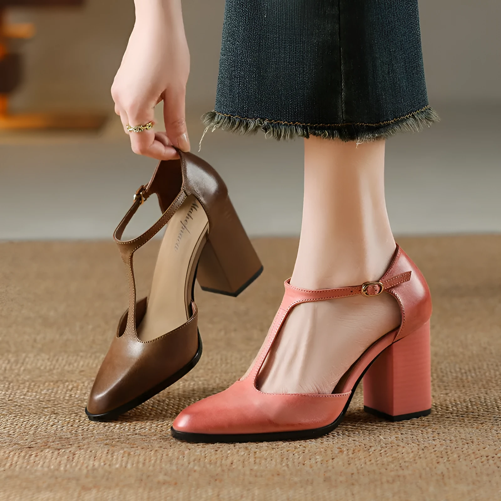 Women's pink and dark brown retro Mary Jane shoes with a pointed toe, buckle, and hollow design detail.
