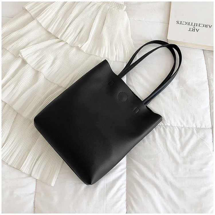 Large-capacity portable tote bag in Black with plain car suture design, soft handle, and single shoulder strap